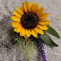 Custom-made boutonniere showcasing intricate floral details.