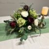 Plum Floral Arrangement by Blooms Collection: A captivating fusion of roses, berries, hydrangeas, eucalyptus, and greens. Versatile centerpiece or aisle decoration, perfect for weddings or special events. Premium artificial flowers ensure lifelike allure.