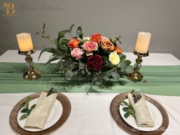 Stunning Floral Arrangement by Blooms Collection: Vibrant magenta, yellow, orange, and pink tones with roses, peonies, eucalyptus, and rose leaves. Ideal for weddings, corporate events, birthdays, and evening functions.